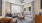 Sunlit living room and dining space at The Morgan Apartments in Chapel Hill, featuring hardwood-style floors and elegant furnishings