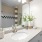 Modern bathroom at The Morgan Chapel Hill featuring granite countertops, hardwood-style flooring, tub/shower combo, tiled walls, and ample cabinet storage