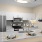 Spacious living area at The Morgan Apartments in Chapel Hill with stainless steel kitchen appliances and elegant granite countertops
