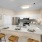 Stylish kitchen and living room in a model unit at The Morgan Apartments, Chapel Hill, featuring granite countertops and stainless steel appliances