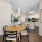 Bright and open living space at The Morgan, Chapel Hill, complete with stainless steel kitchen appliances and hardwood-style floors